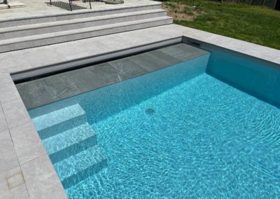 Construction piscine avec terrasse carrelage et PVC armé
